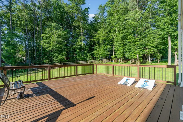 a view of deck with wooden floor and fence