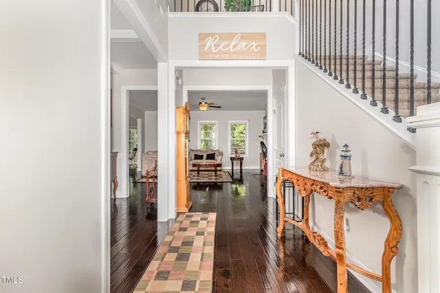 a view of living room with furniture and wooden floor