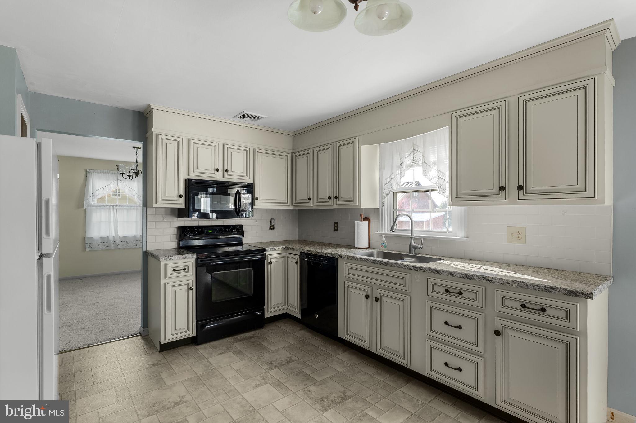 2 Arlin Circle Lititz, PA 17543 - Photo 11 of 50 a kitchen with stainless steel appliances granite countertop a stove a sink and a refrigerator