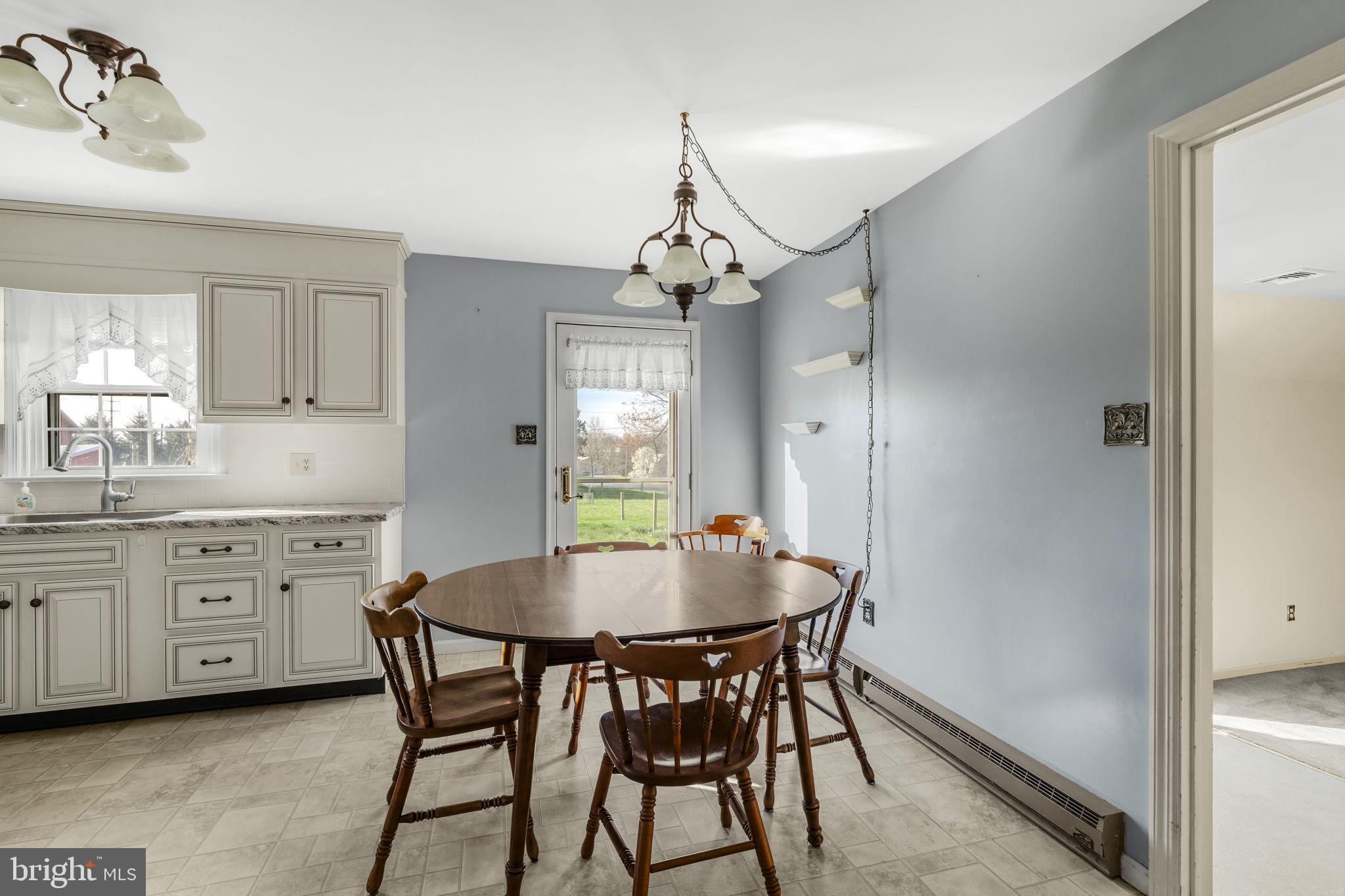 2 Arlin Circle Lititz, PA 17543 - Photo 14 of 50 a dining room that has a dining table and chairs in it