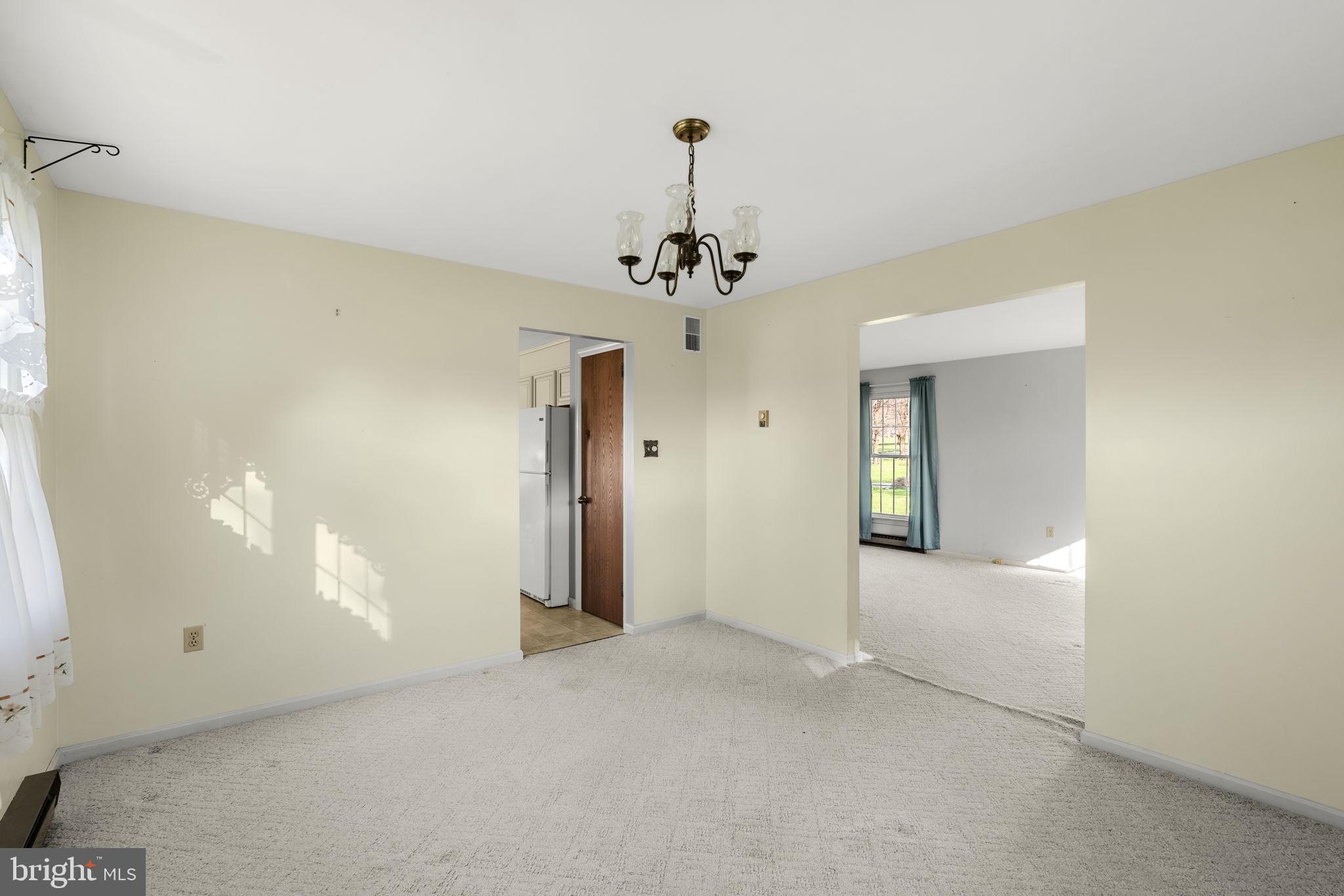 2 Arlin Circle Lititz, PA 17543 - Photo 9 of 50 a view of a hallway with a chandelier