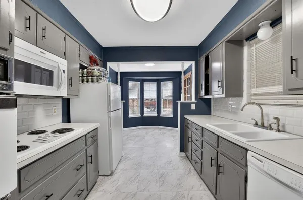 a kitchen with a stove and a sink