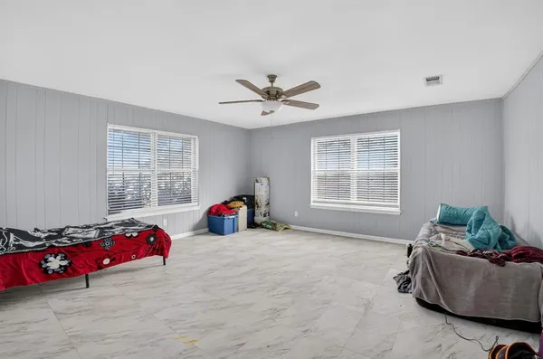 a living room with furniture and windows