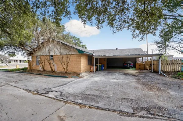 a view of a house with a yard and garage