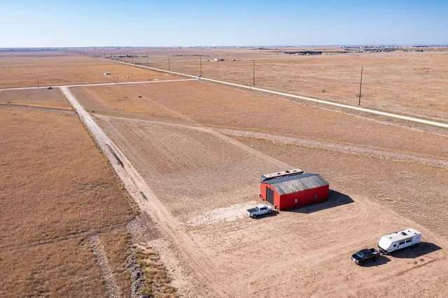 a view of a room with a floor to ceiling window and stairs