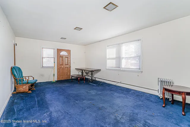 a bedroom with furniture and window
