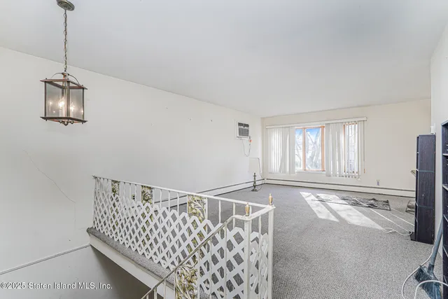 a bathroom with a granite countertop double vanity sink a mirror and a shower