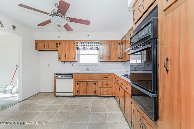 an aerial view of residential houses with yard