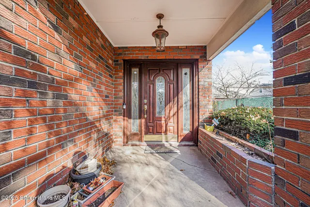 a view of a livingroom with wooden floor and a window