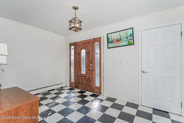 a area with a white wall and a clock on the wall