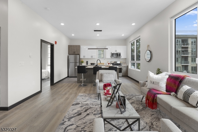 1369 South Avenue, Unit 5 Plainfield, NJ 07062 - Photo 2 of 11 a living room with furniture and kitchen view