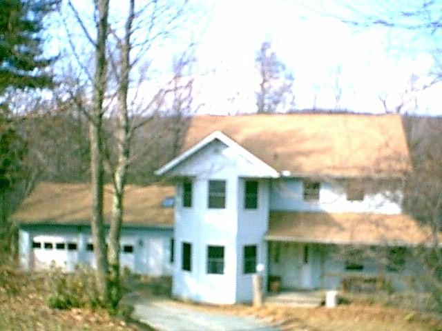3463 Devils Hole Road Cresco, PA 18326 - Photo 1 of 1 a front view of a house with lake view