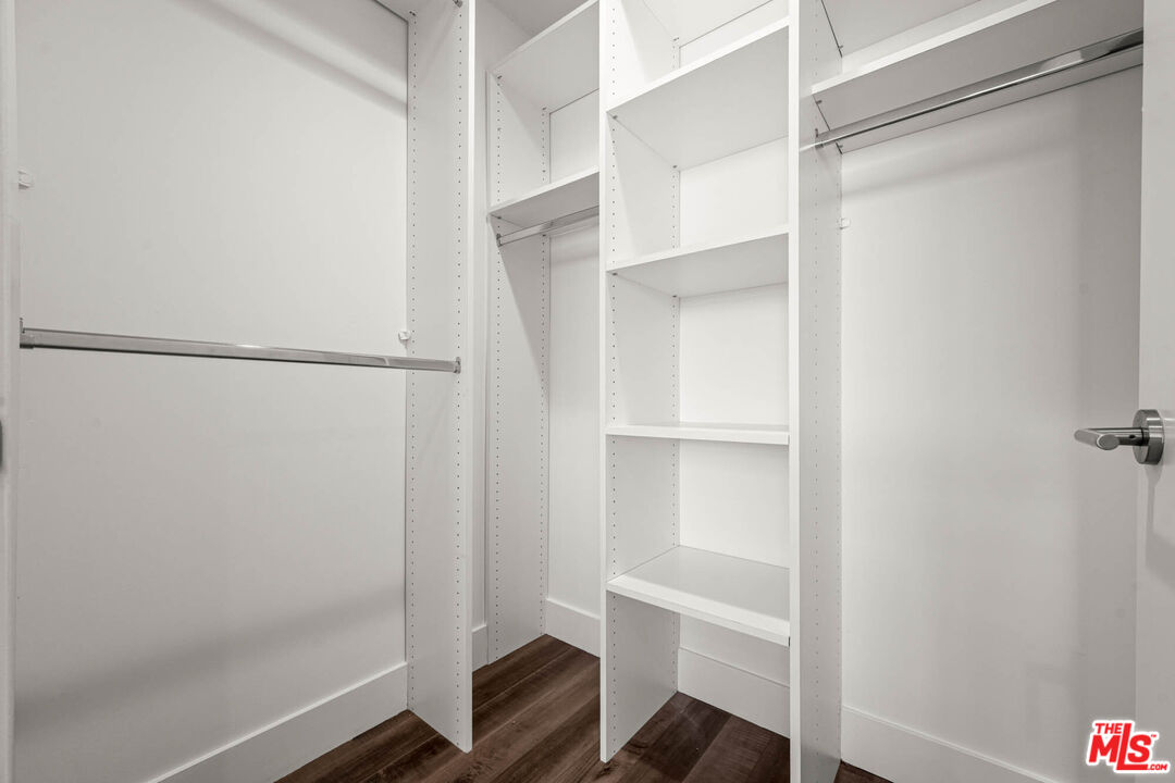 1215 South Bedford Street, Unit 105 Los Angeles, CA 90035 - Photo 13 of 27 a view of walk in closet with empty racks