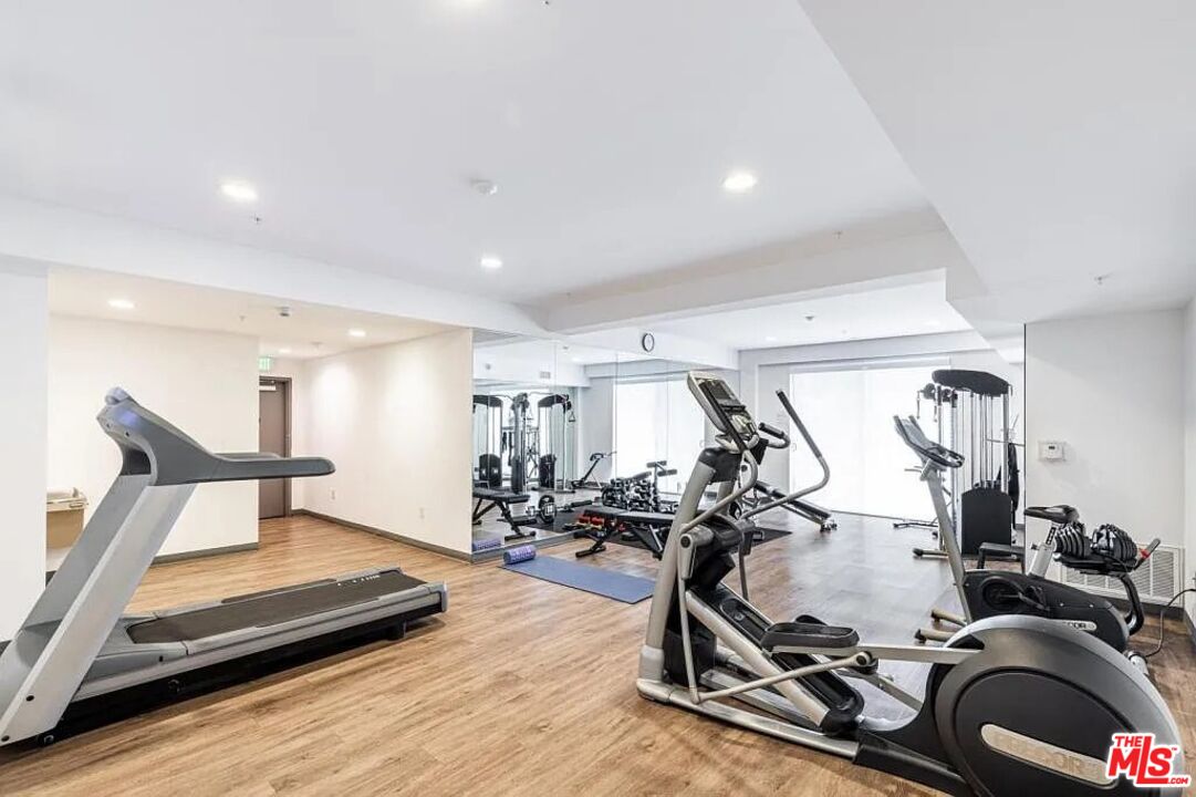 1215 South Bedford Street, Unit 105 Los Angeles, CA 90035 - Photo 25 of 27 a view of a room with gym equipment
