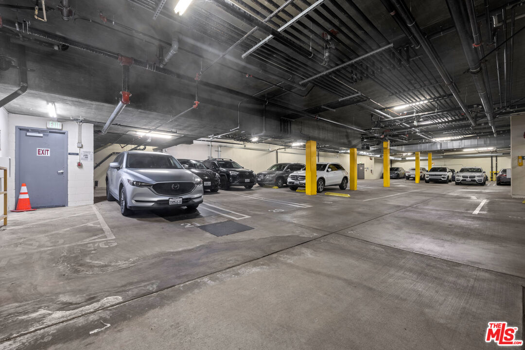 1215 South Bedford Street, Unit 105 Los Angeles, CA 90035 - Photo 27 of 27 a view of parking garage with cars
