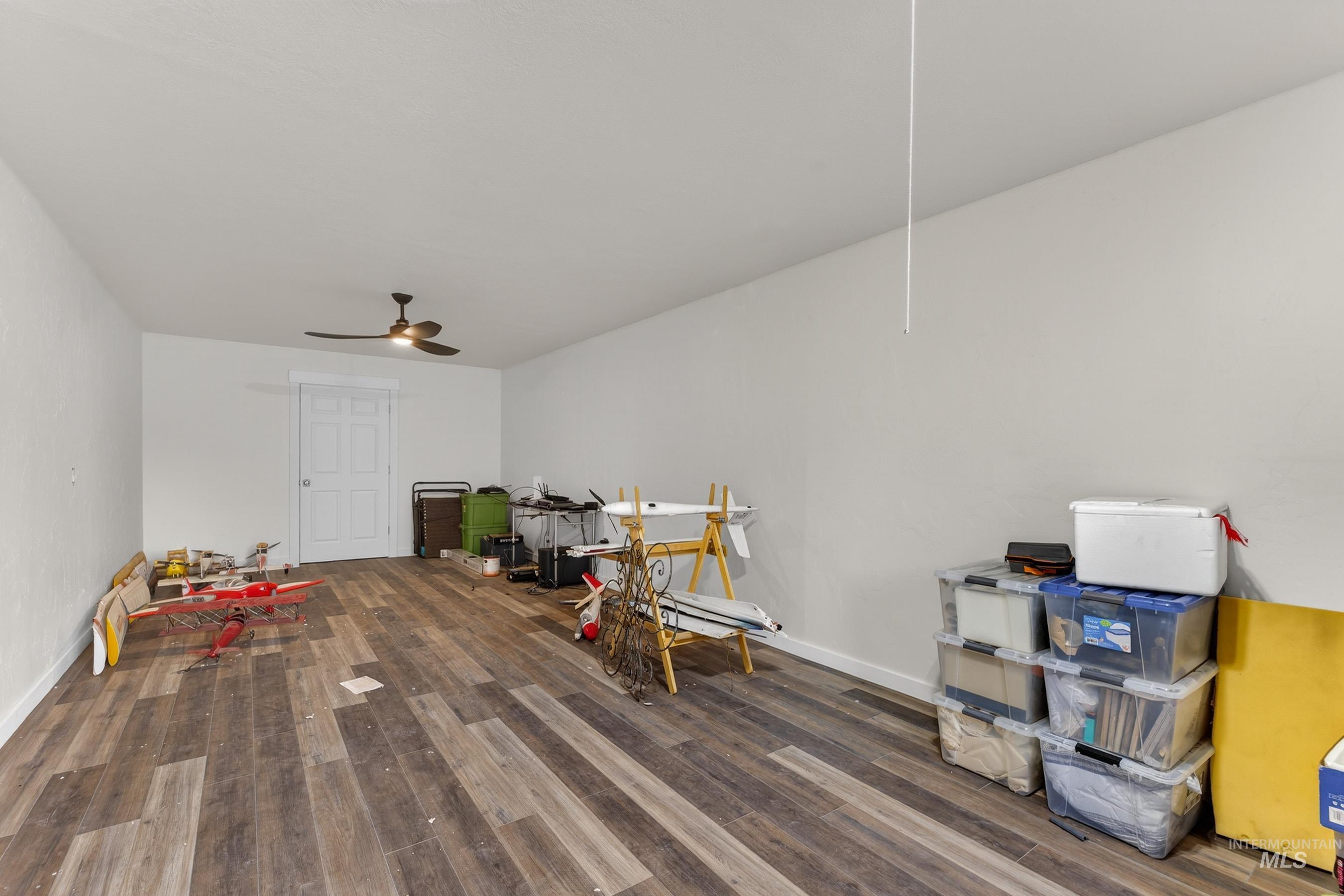 10191 Timberrim Drive Cascade, ID 83611 - Photo 32 of 44 Playroom with dark wood-style flooring and ceiling fan