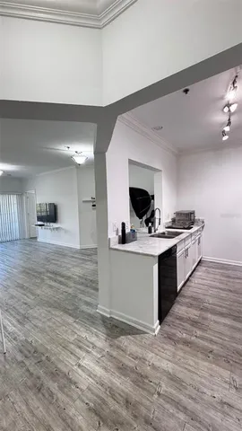 a kitchen with stainless steel appliances a stove top oven and cabinets