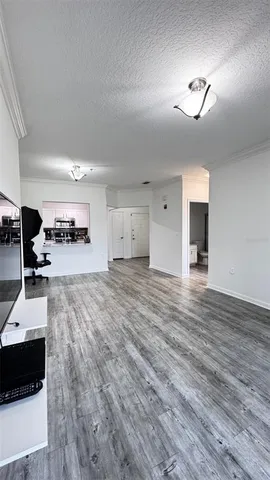 a view of a living room and kitchen