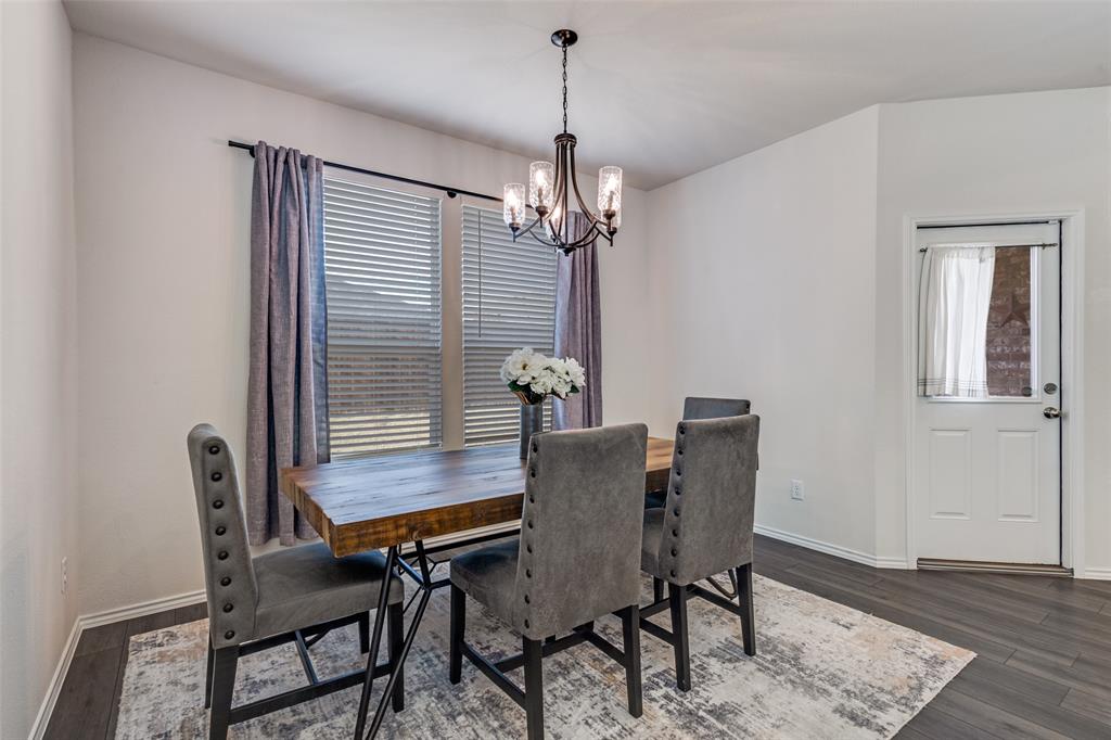 1810 Hummingbird Street Princeton, TX 75407 - Photo 25 of 25 a view of a dining room with furniture window and wooden floor