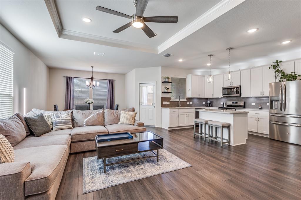 1810 Hummingbird Street Princeton, TX 75407 - Photo 6 of 25 a living room with furniture and kitchen view