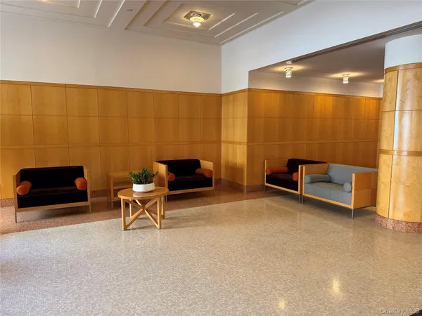 a view of a room with a table and chairs