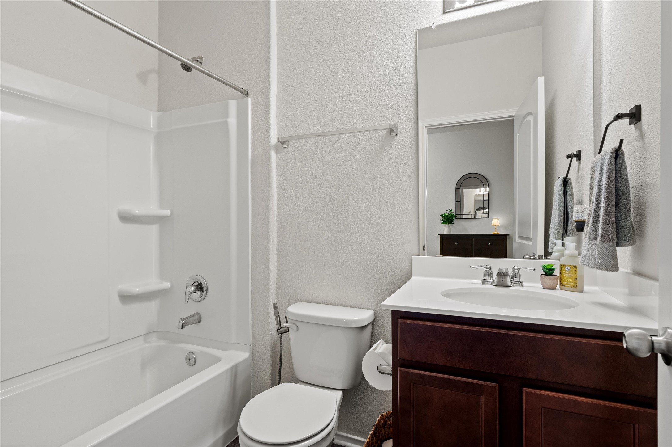 11816 Jackson Fls Way Manor, TX 78653 - Photo 18 of 40 a bathroom with a sink a toilet and shower