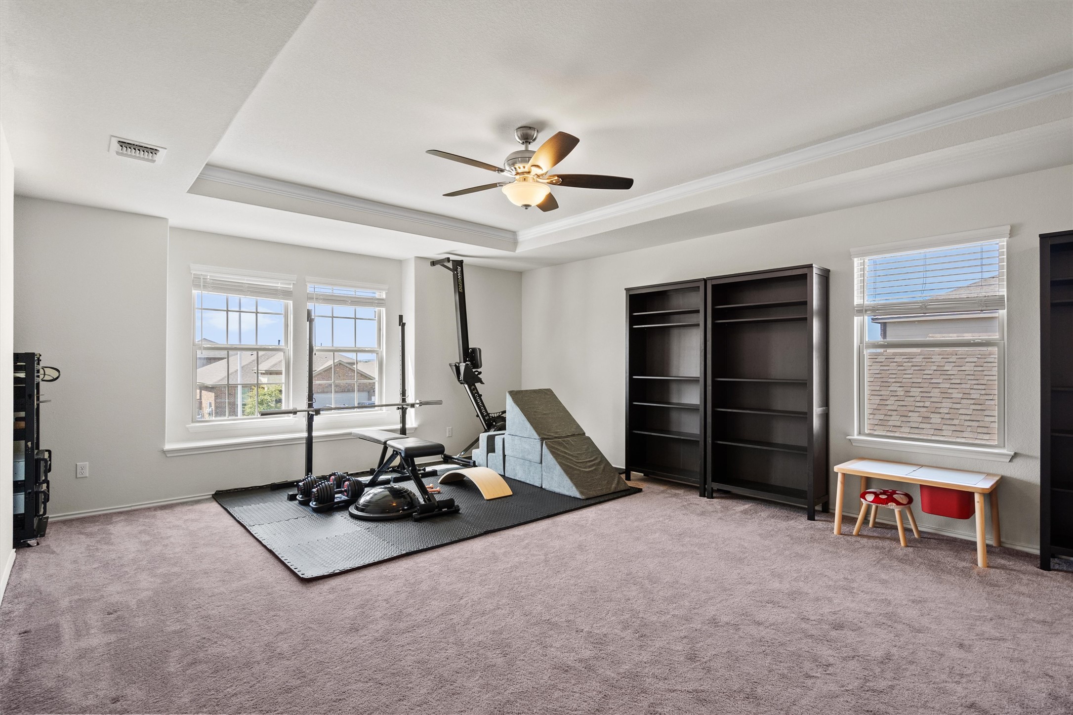 11816 Jackson Fls Way Manor, TX 78653 - Photo 21 of 40 a living room with furniture gym equipment and a window