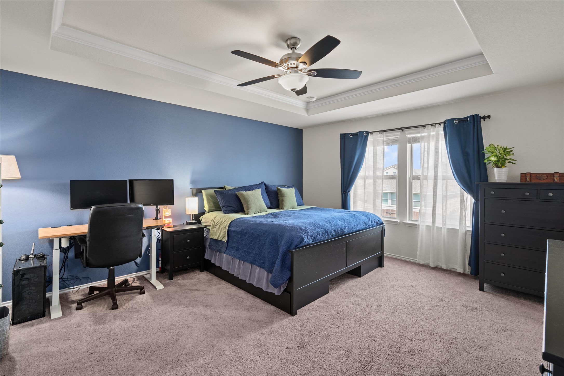 11816 Jackson Fls Way Manor, TX 78653 - Photo 23 of 40 a spacious bedroom with a bed and window