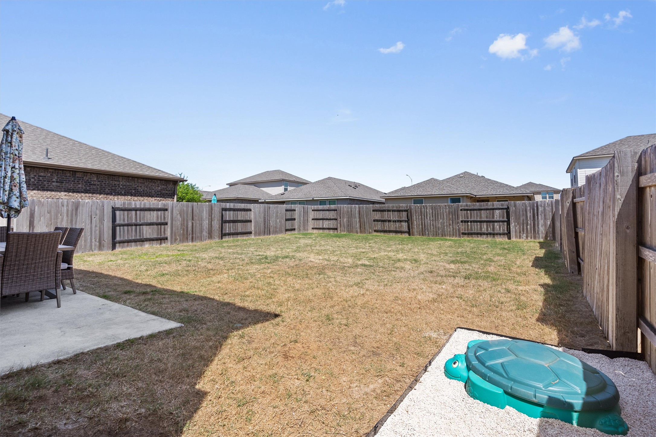 11816 Jackson Fls Way Manor, TX 78653 - Photo 34 of 40 a front view of a house with garden