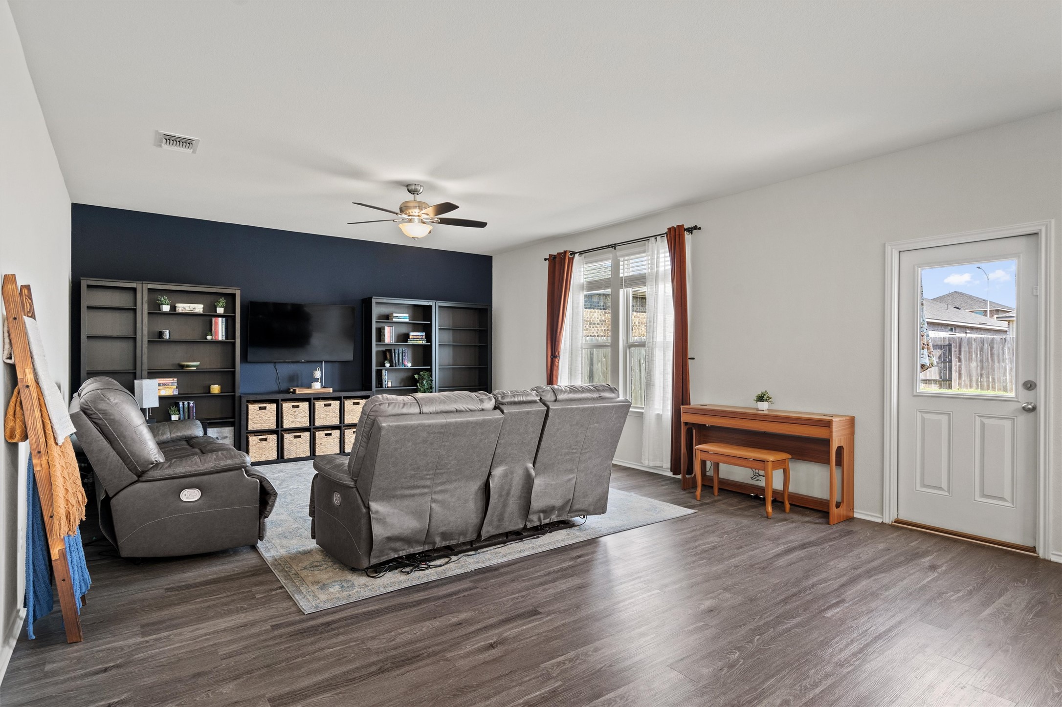 11816 Jackson Fls Way Manor, TX 78653 - Photo 6 of 40 a living room with furniture and a wooden floor