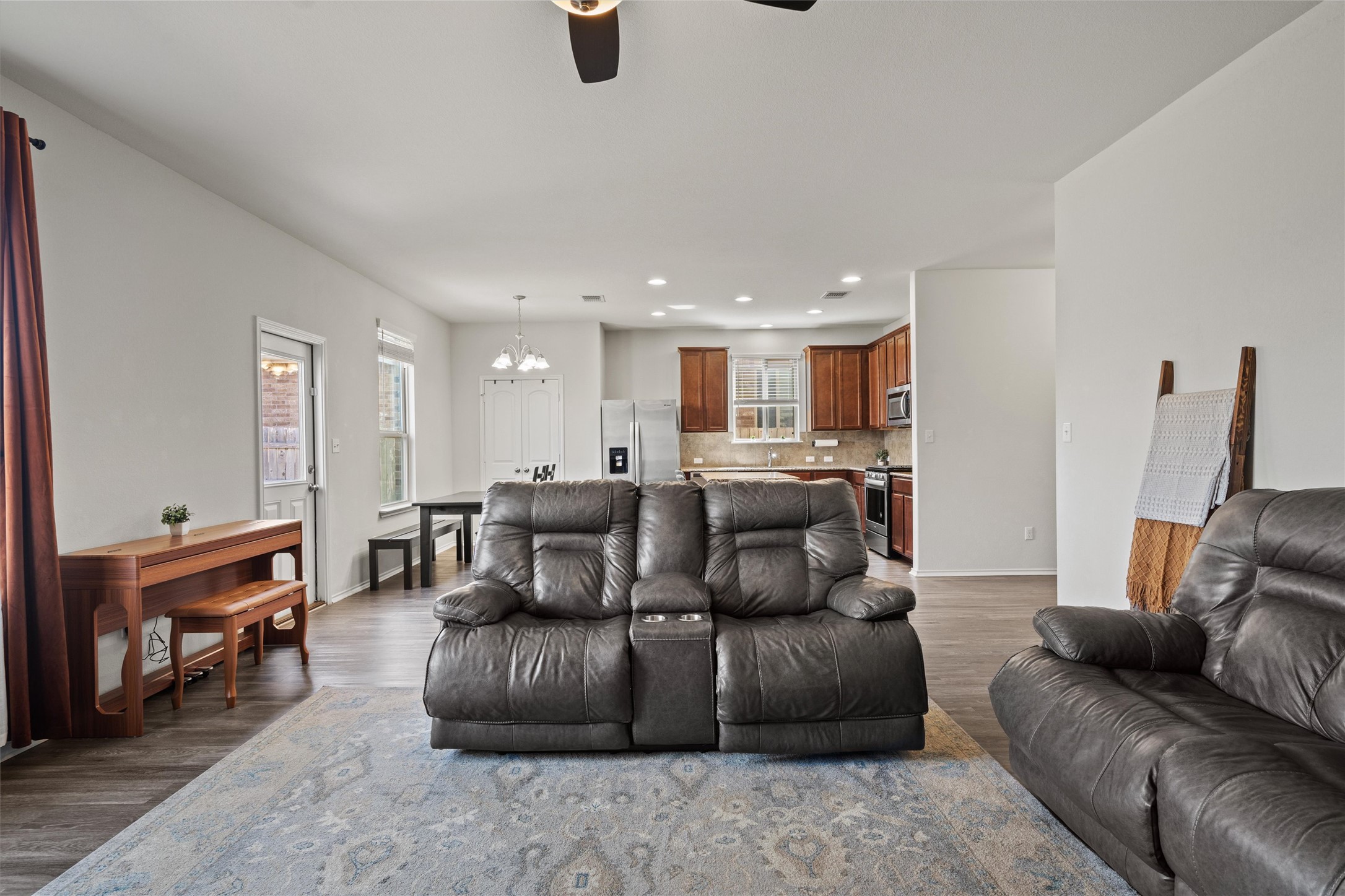 11816 Jackson Fls Way Manor, TX 78653 - Photo 10 of 40 a living room with furniture and a piano