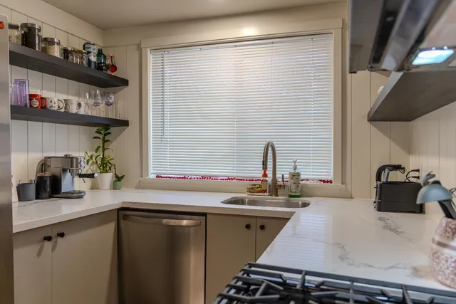 a kitchen with a sink and cabinets