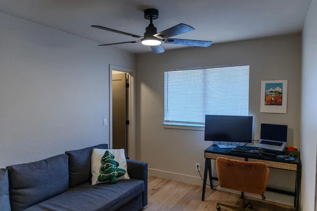 a work room with furniture and a window