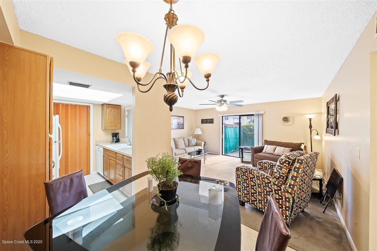 598 North Wickham Road, Unit 73 Melbourne, FL 32935 - Photo 10 of 33 Dining Area w/Chandelier