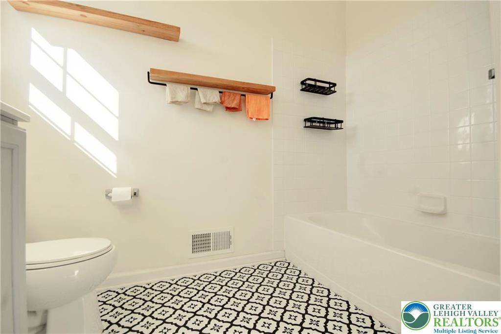 5392 Spring Ridge Drive West Lower Macungie Township, PA 18062 - Photo 14 of 17 a bathroom with a shower a toilet and a shower