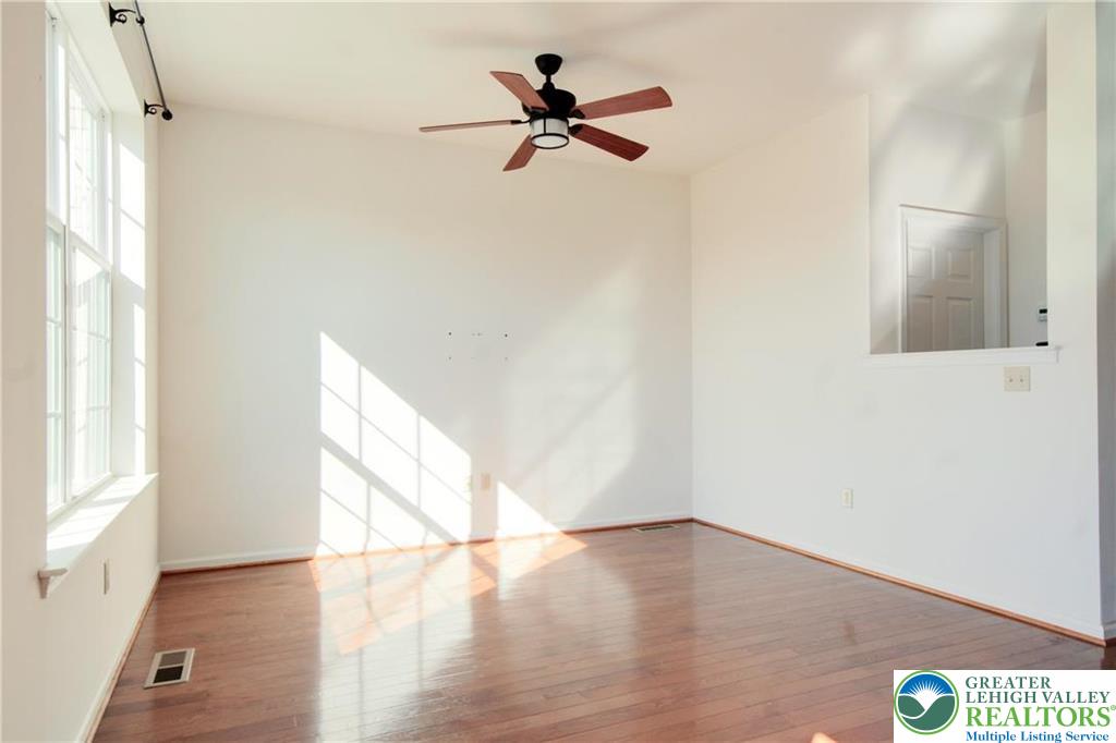 5392 Spring Ridge Drive West Lower Macungie Township, PA 18062 - Photo 7 of 17 a view of empty room with wooden floor and fan