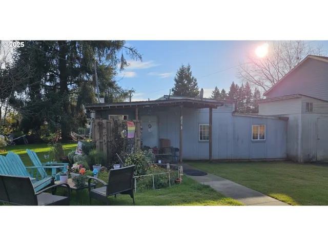 a view of a porch with furniture and floor to ceiling window
