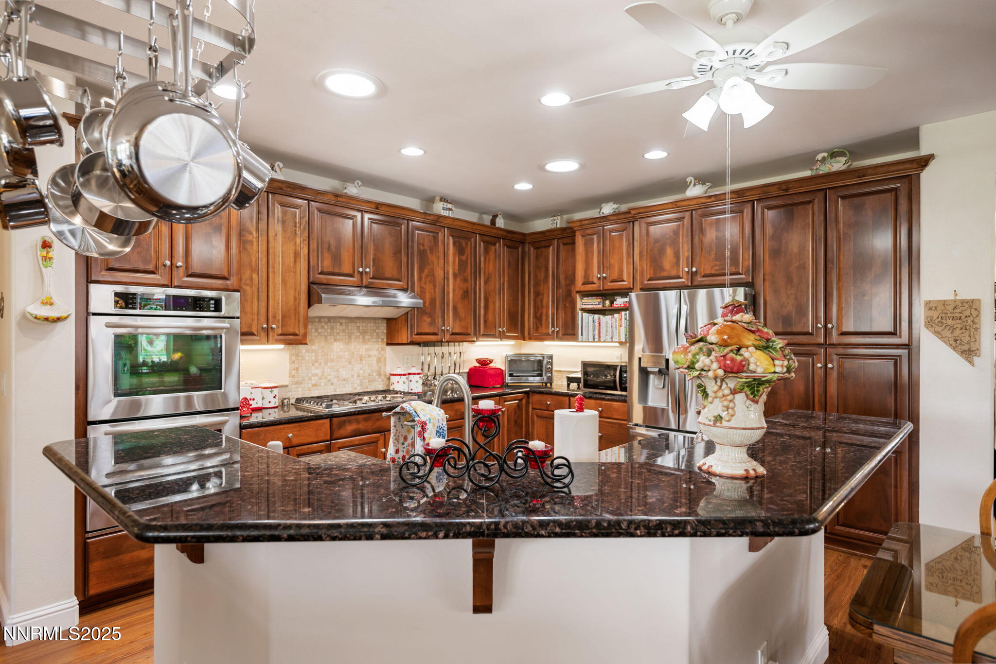 112 Eagle Brook Lane Dayton, NV 89403 - Photo 25 of 48 a kitchen with stainless steel appliances granite countertop a sink window and cabinets