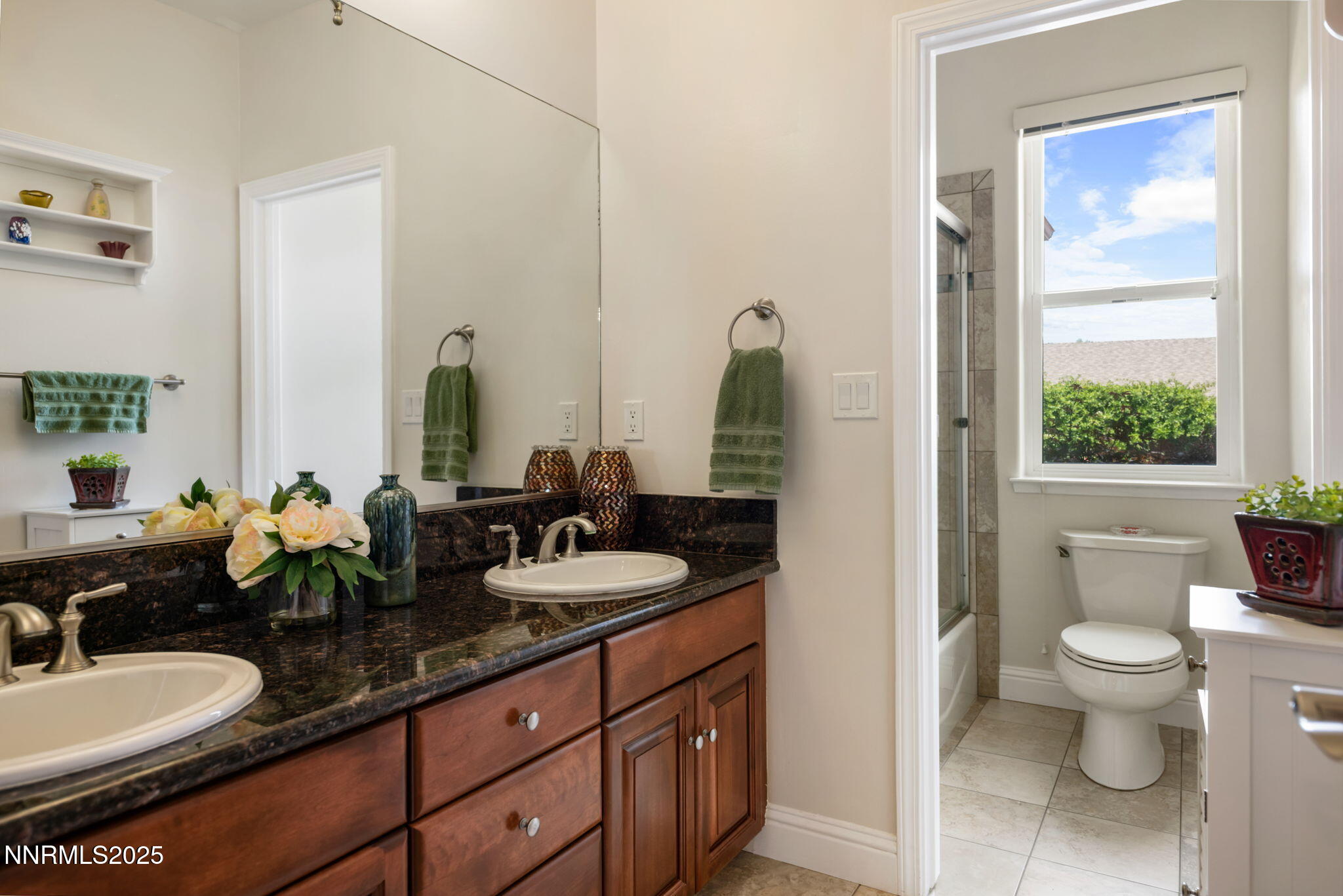 112 Eagle Brook Lane Dayton, NV 89403 - Photo 32 of 48 a bathroom with a double vanity sink toilet and a mirror