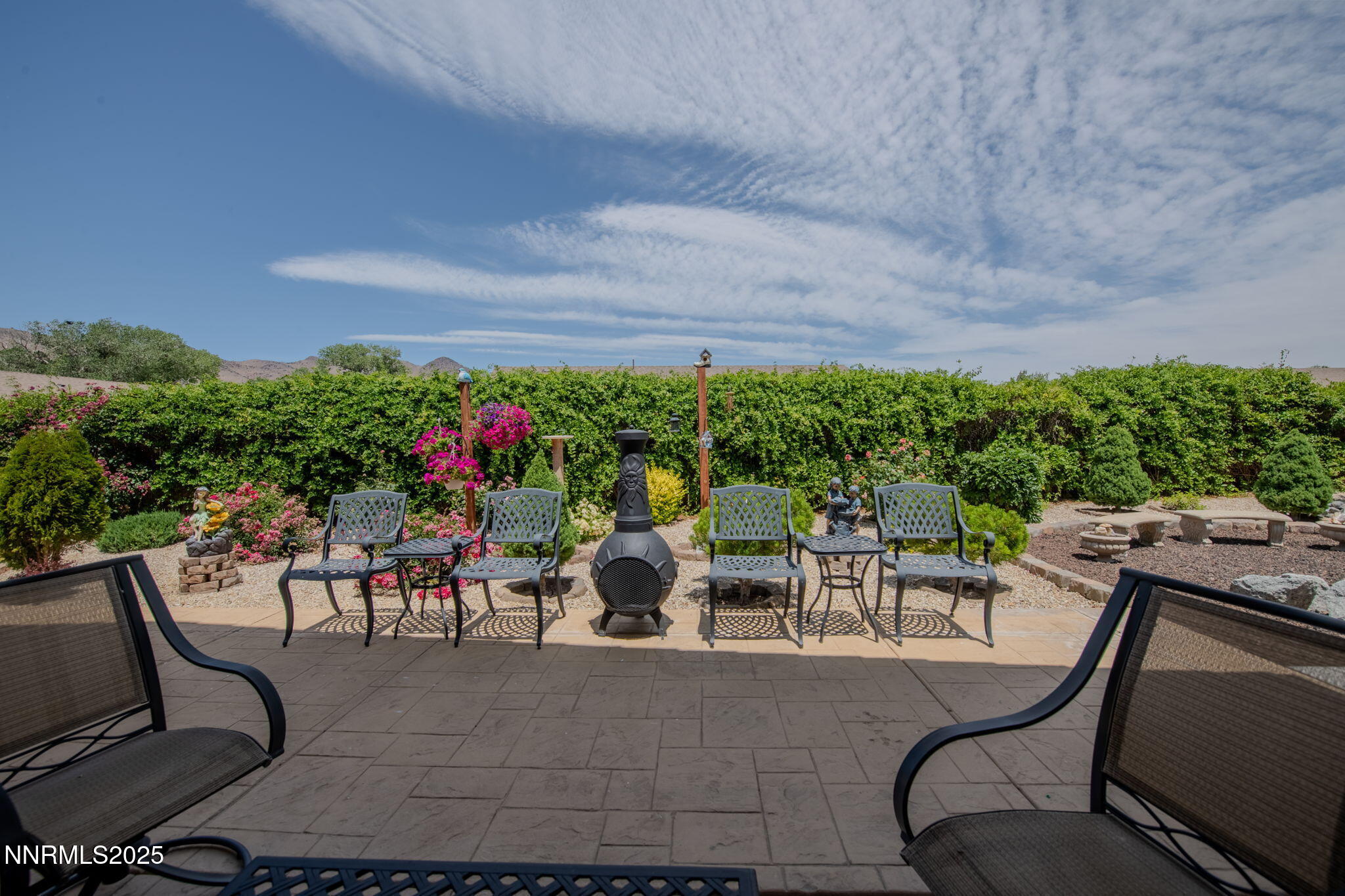 112 Eagle Brook Lane Dayton, NV 89403 - Photo 42 of 48 a view of a patio with couches table and chairs and potted plants
