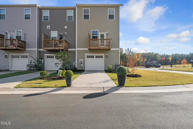 a view of a house with a outdoor space and seating area