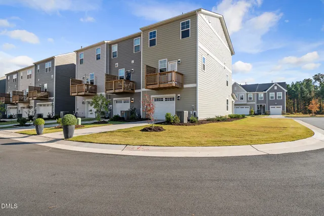 a view of a swimming pool with a house in the background