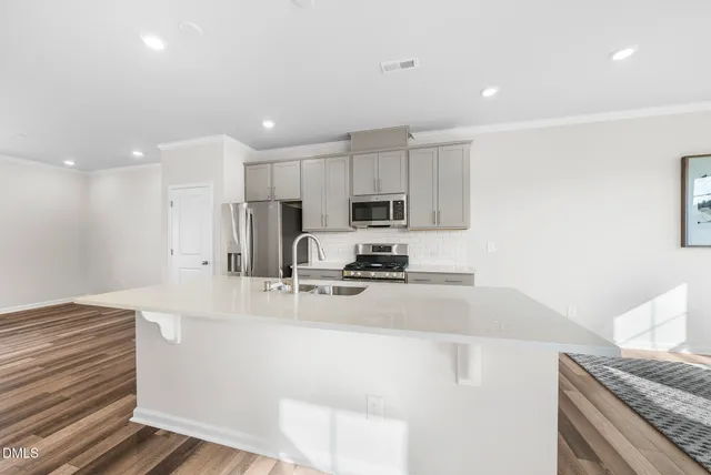 a kitchen with counter top space and stainless steel appliances