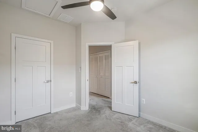 an empty room with closet area