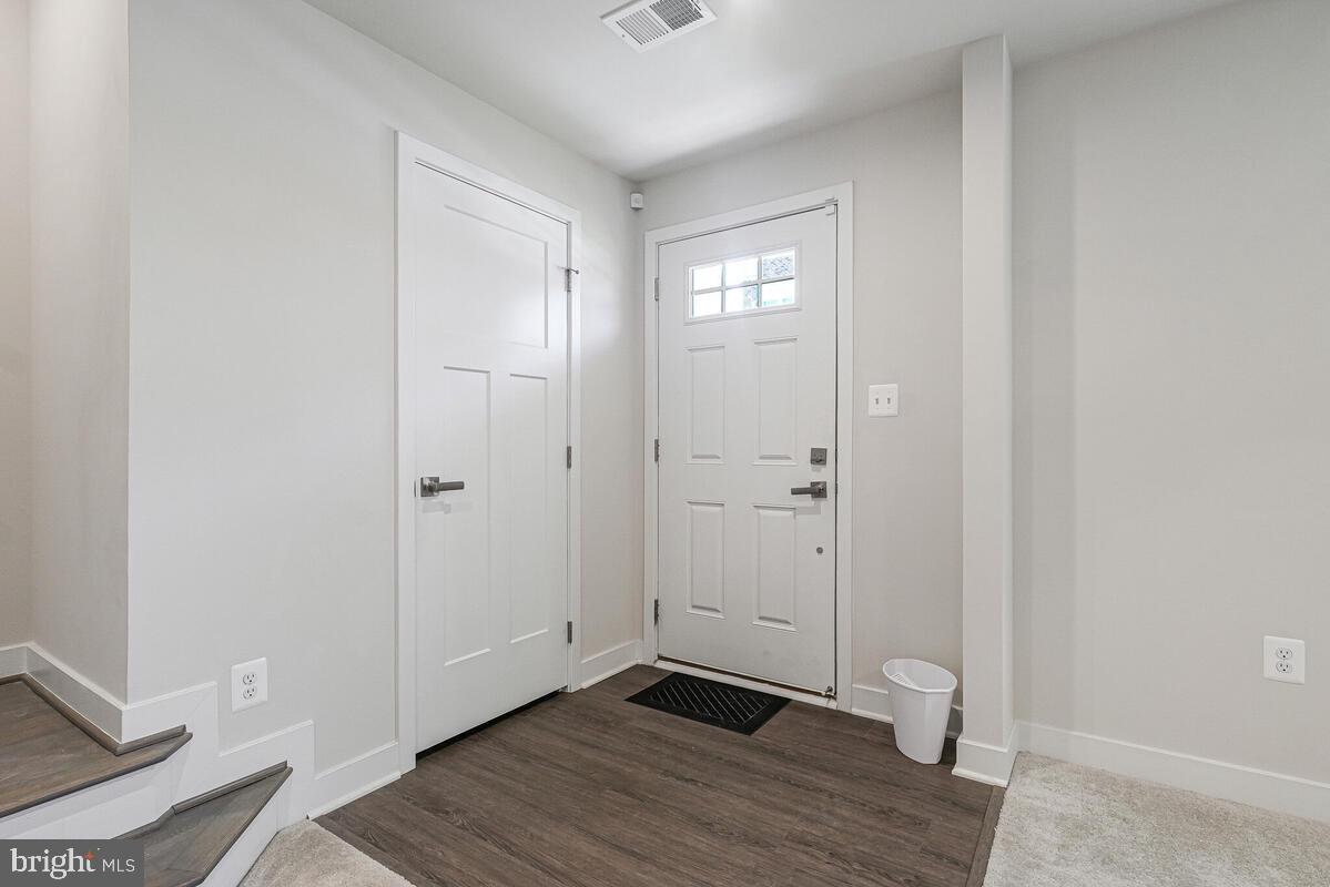 14934 Ring House Road Brandywine, MD 20613 - Photo 4 of 34 an empty room with wooden floor and closet