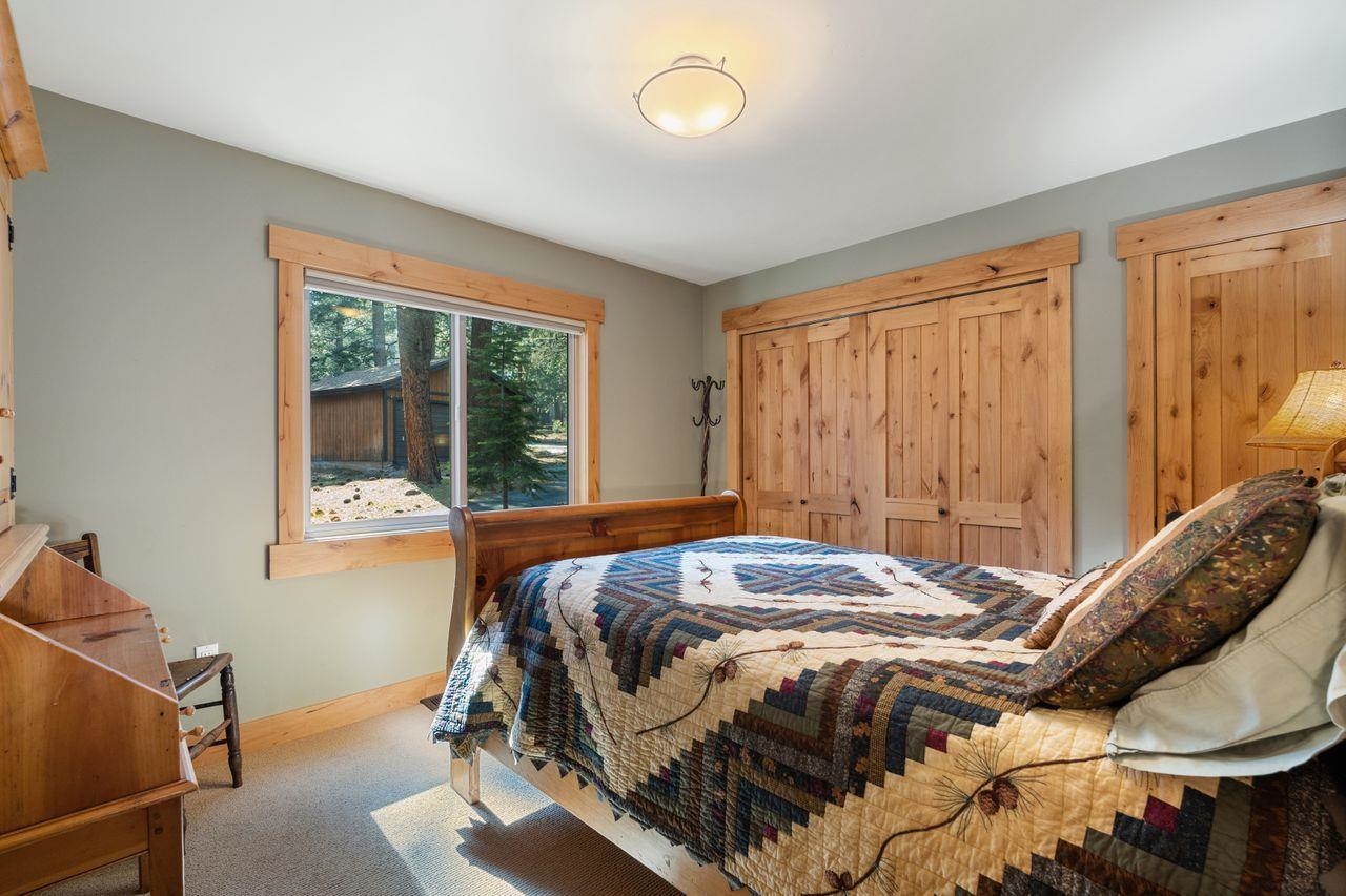 13456 Ski View Loop Truckee, CA 96161 - Photo 12 of 24 a bed sitting in a bedroom next to a window