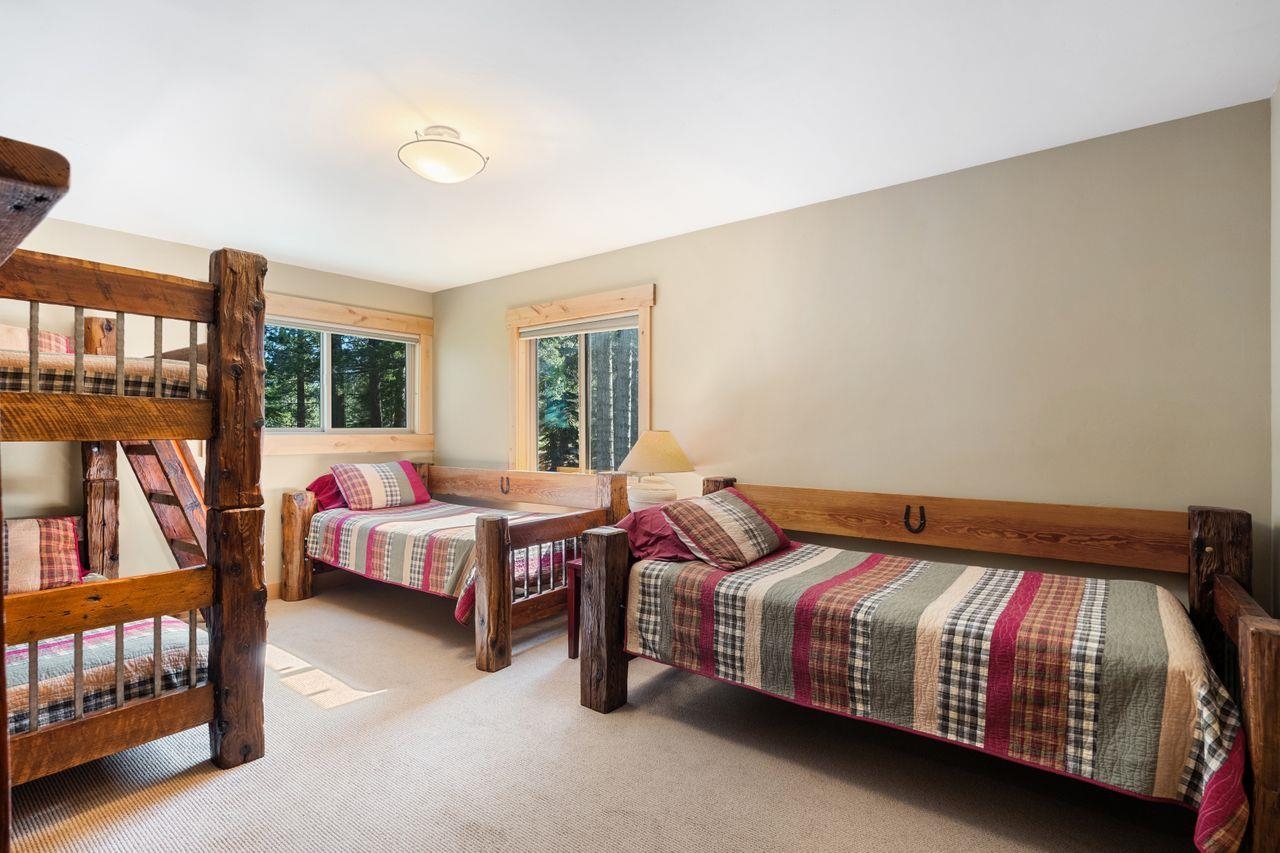 13456 Ski View Loop Truckee, CA 96161 - Photo 13 of 24 a bedroom with a bed and a book shelf