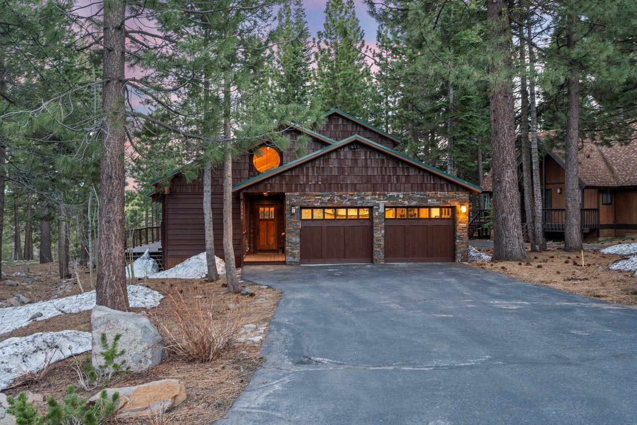 13456 Ski View Loop Truckee, CA 96161 - Photo 4 of 24 a front view of a house with a yard and garage