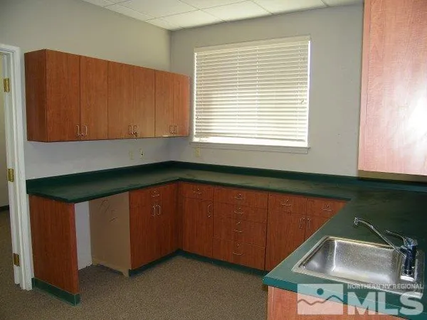 a room with window and cabinet