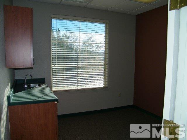 5 Pine Cone Road, Unit 107 Dayton, NV 89403 - Photo 13 of 14 a kitchen with a window a sink and a stove